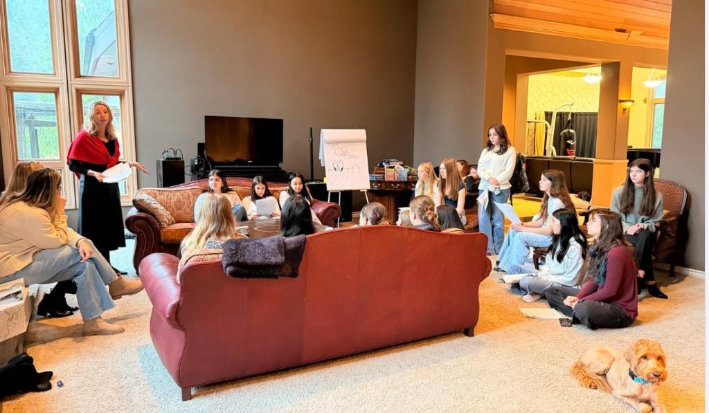 Group etiquette class in a living room setting
