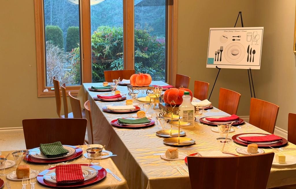 Autumn-themed dining table with pumpkin centerpiece and place setting diagram