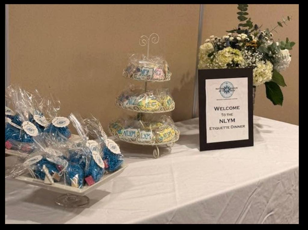 Etiquette class event with guests at a formal dining table
