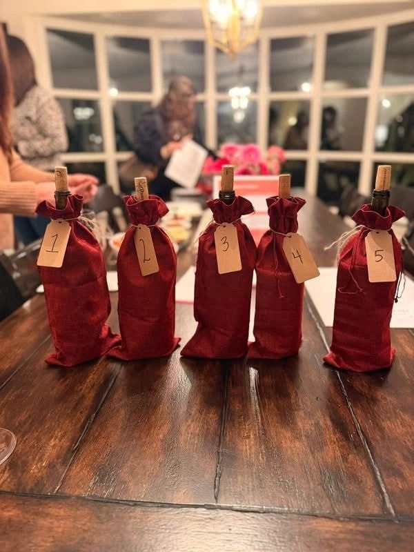 Wine bottle gift bags numbered 1 through 5